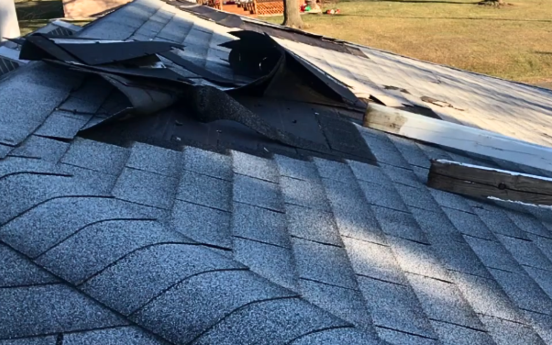 Damaged roof due to wind storm.